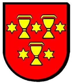 Das Wappen der Stadt Staufen: drei abgedeckte goldene Kelche und fünf goldene Sterne auf rotem Grund